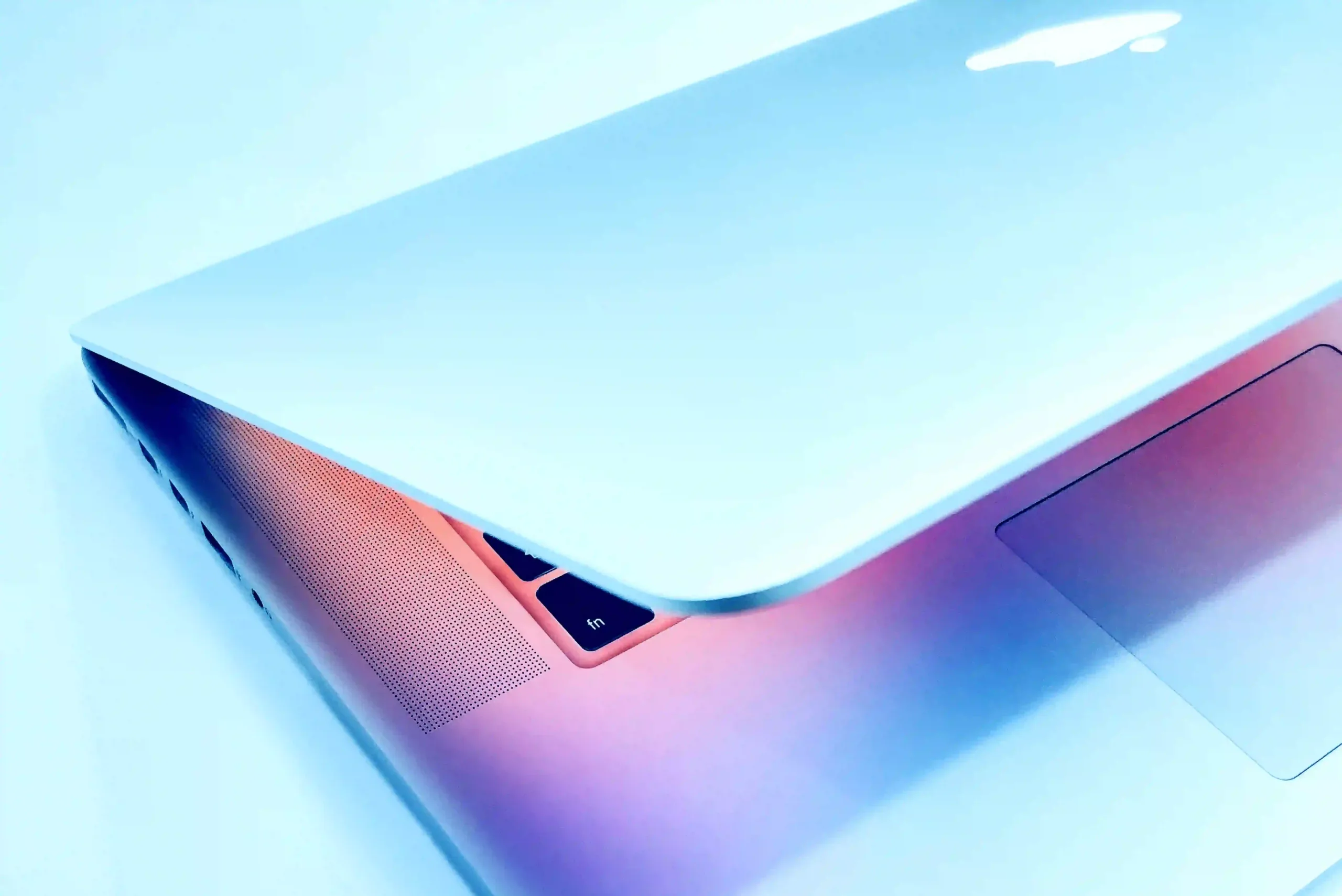 colorful macbook laptop partially opened